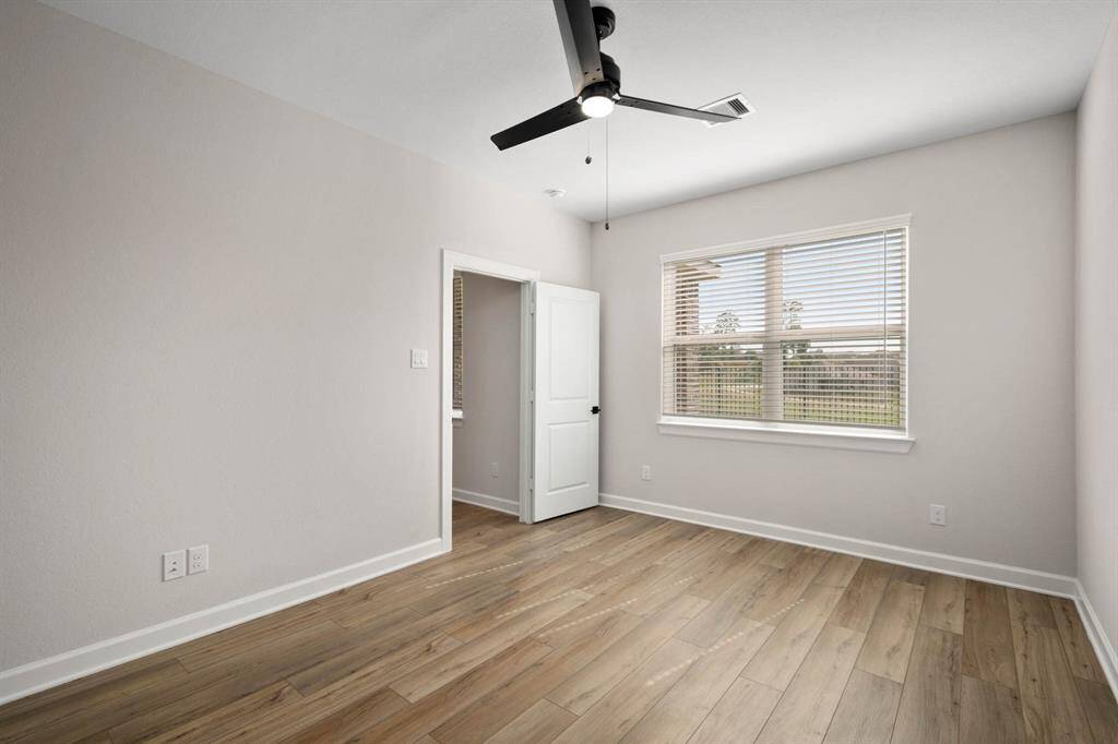 The master bedroom is filled with natural light and a warm and welcoming environment.