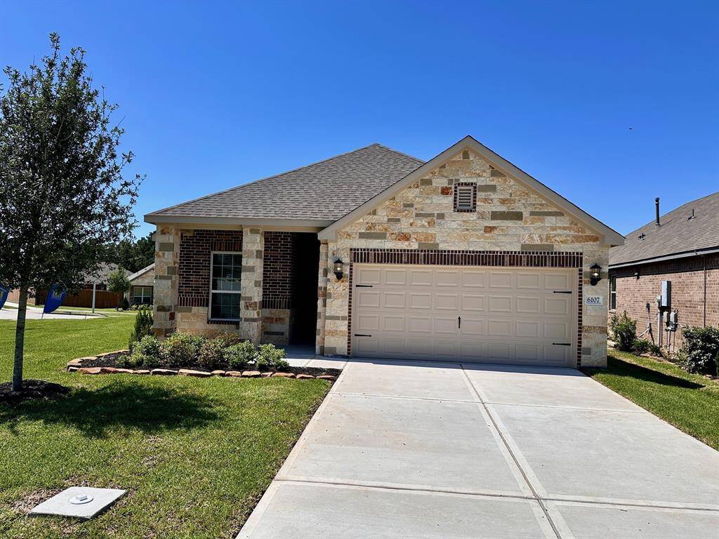 Imagine pulling into the driveway of this beautiful one-story home featuring a modern brick and stone design.