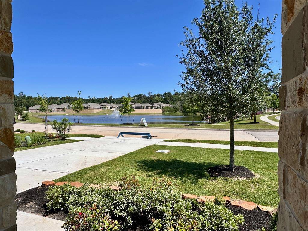 Look at the beautiful view of the community's fishing pond from your front porch!