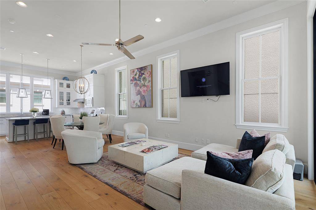 The second floor of this extraordinary home serves as the heart of daily living — a thoughtfully designed open-concept space where elegance meets effortless functionality. Framed by floor-to-ceiling windows and flooded with natural light, the layout seamlessly integrates the living room, dining area, and chef’s kitchen into one harmonious environment, perfect for both entertaining and relaxed living.