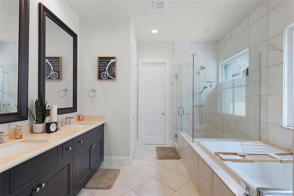 Your very own spa-like retreat with a tall tempered glass shower and deep jetted tub.