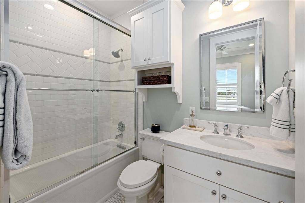 En-suite bathroom off of Guest Bedroom offers a shower tub.