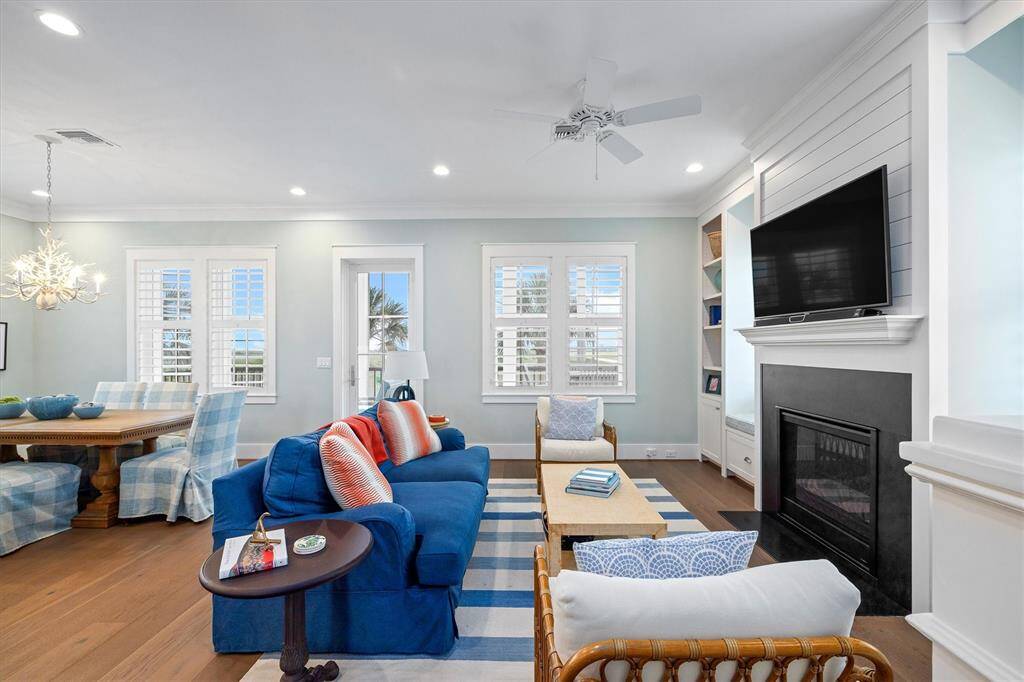 The Living Room offers inviting natural light and access to a large porch with a scenic sunrise views.