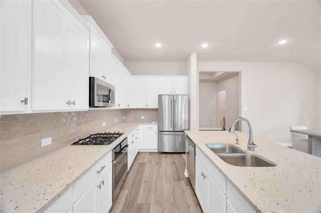Granite Countertops, Upgraded Backsplash, and 36" Gas Cooktop