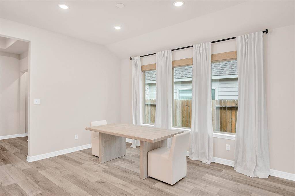 Dining Room with Tall, Sloped Ceiling