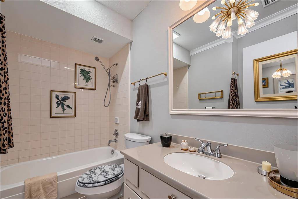 Full Bath With Timeless TouchesThis well-maintained bathroom features a shower/tub combo, updated lighting, and a neutral palette—ready for guests or daily use with ease.