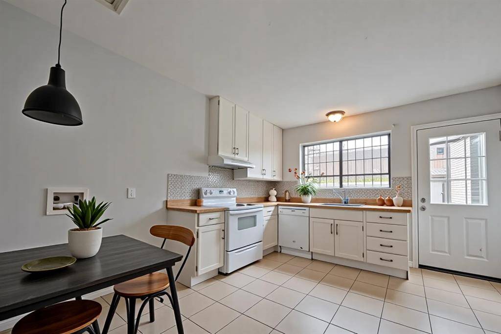 Light-Filled Kitchen With Classic LayoutThis spacious kitchen boasts a smart, functional layout with natural light, ample cabinet space, and direct access to the outdoor patio—perfect for everyday living.