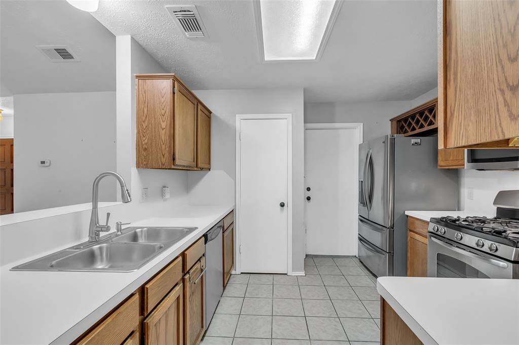 The Kitchen has dedicated pantry, wine rack and access to the garage.