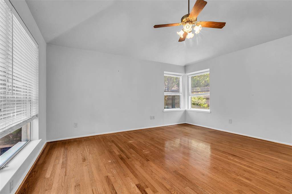 The Primary Bedroom has views to the back courtyard, backyard and side yard.