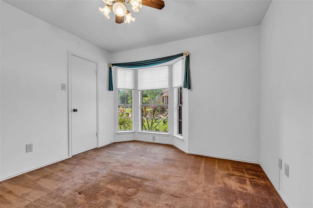 Bedroom 2 features a Bay Window with view to the front, Ceiling Fan with Lighting and large closet.