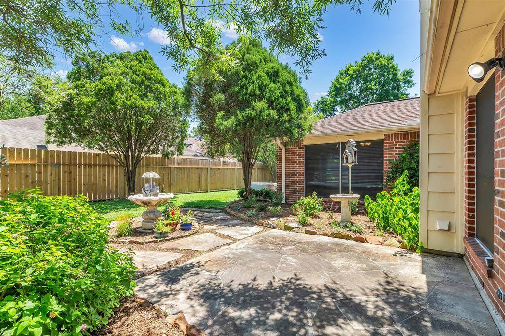 You will enjoy the relaxing back courtyard that is beautifully landscaped with fountain, bird bath and flower gardens.  This home also has solar screens for energy efficiency.