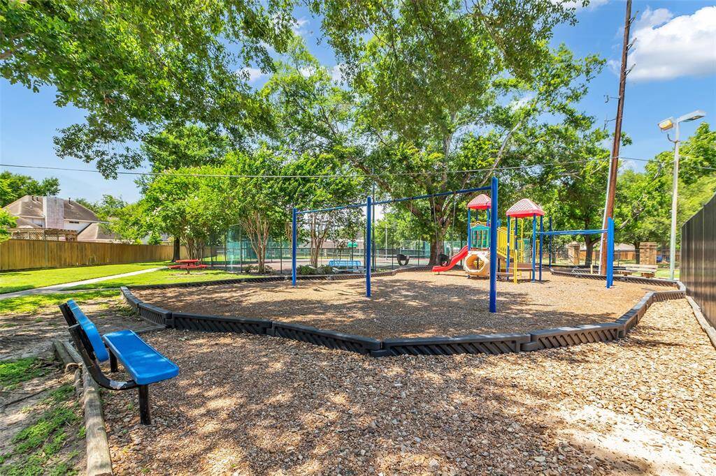 Photo of the community play ground and pool.