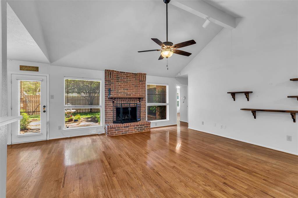 The family room has open views and access to the back courtyard area.  The windows have solar screens for energy efficiency.