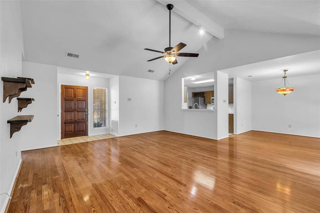 This view of the Family Room shows the Breakfast/Dining area and Kitchen entry.