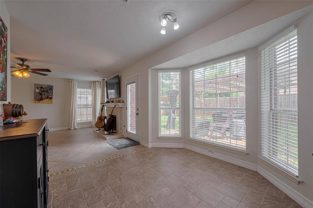 Cozy breakfast nook with expansive garden views.