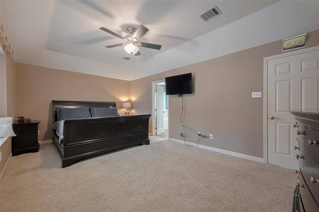 This inviting Primary Bathroom features a relaxing jacuzzi tub, separate shower, a sleek double vanity with granite countertops, and ample natural light from the large window. Perfect for unwinding after a long day.