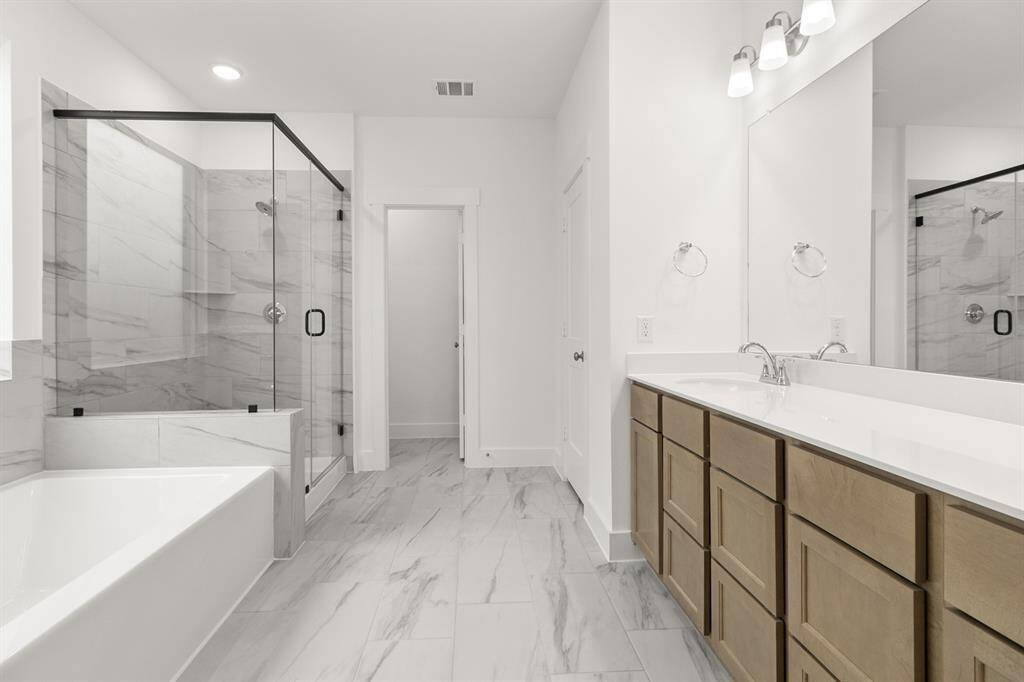 The elegant finishes, from the dazzling floors to the chic light fixtures, reflect a careful attention to detail that feels both luxurious and comforting.