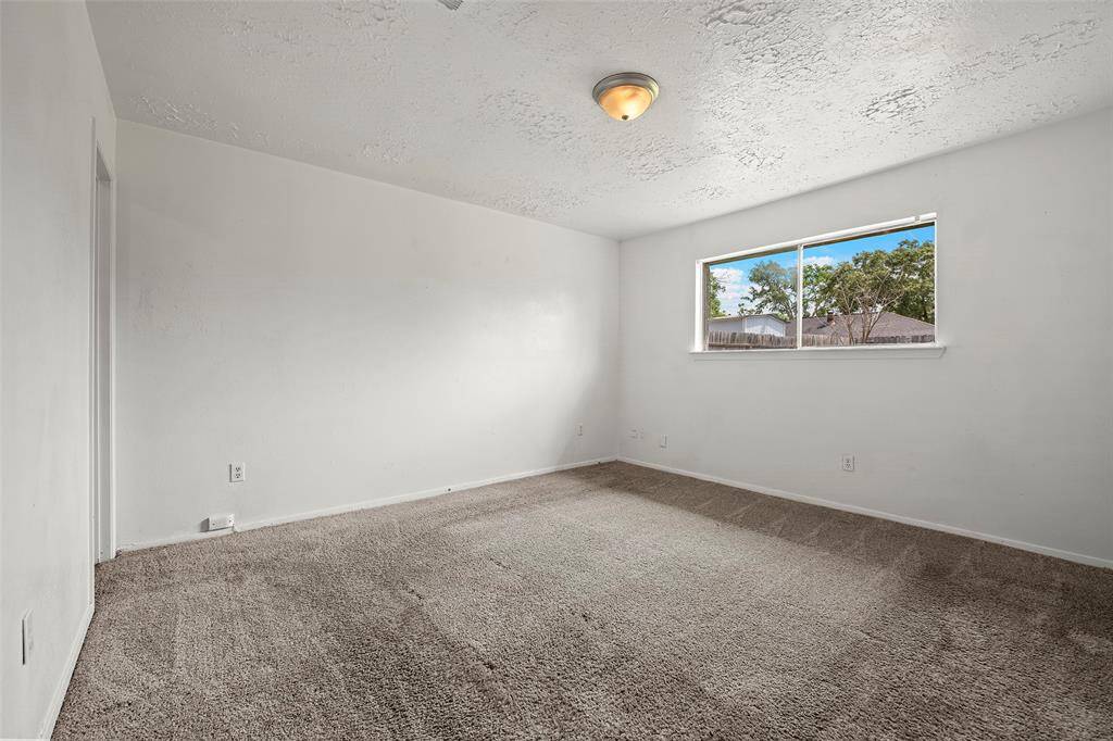A serene primary suite with soft carpet under foot!