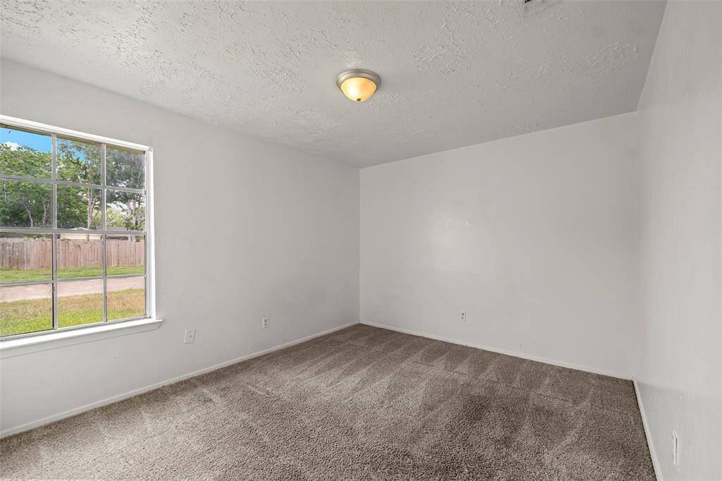 One of two secondary bedrooms awaits new residents to make it their own!