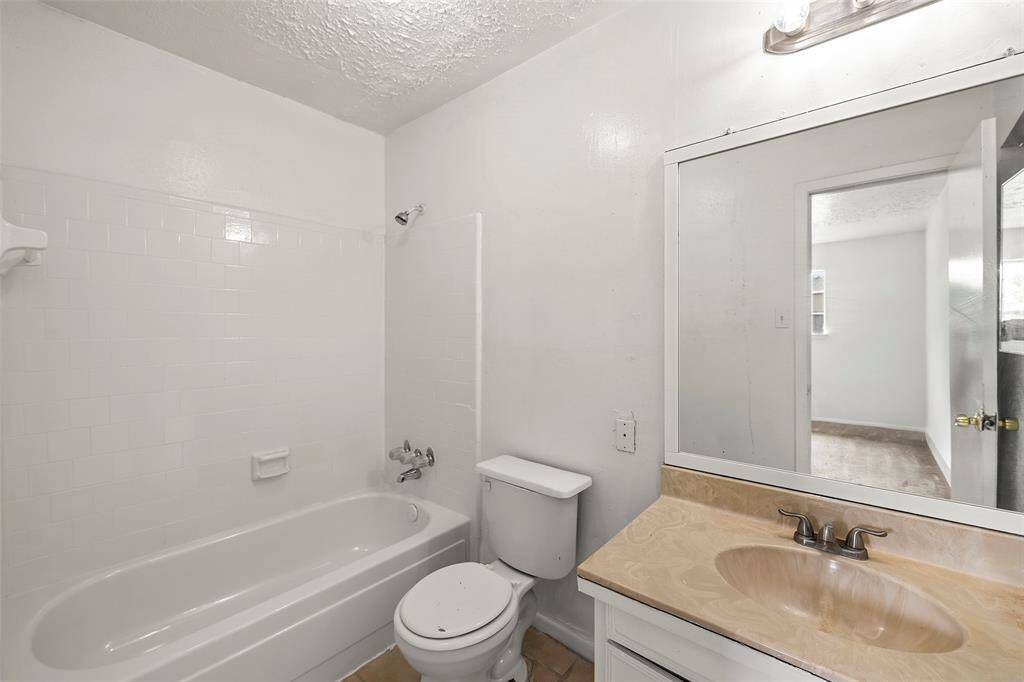 A full-sized secondary bathroom with vanity for storage!