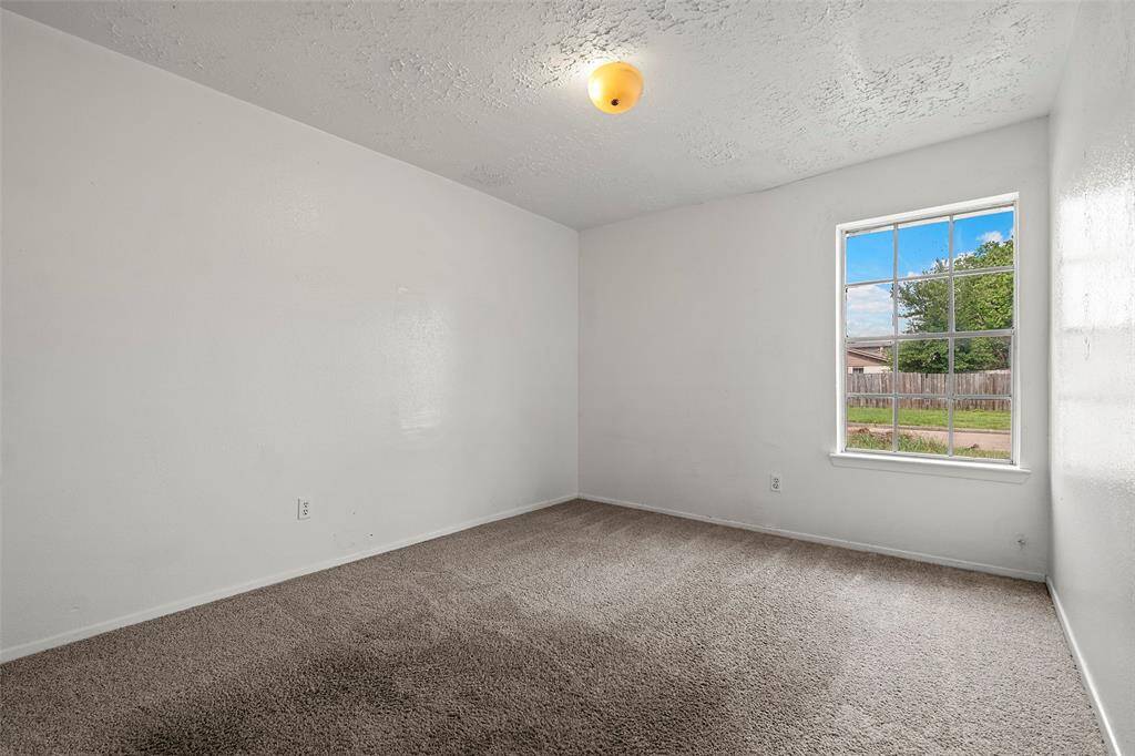 Another secondary bedroom with picture window allowing in natural light!