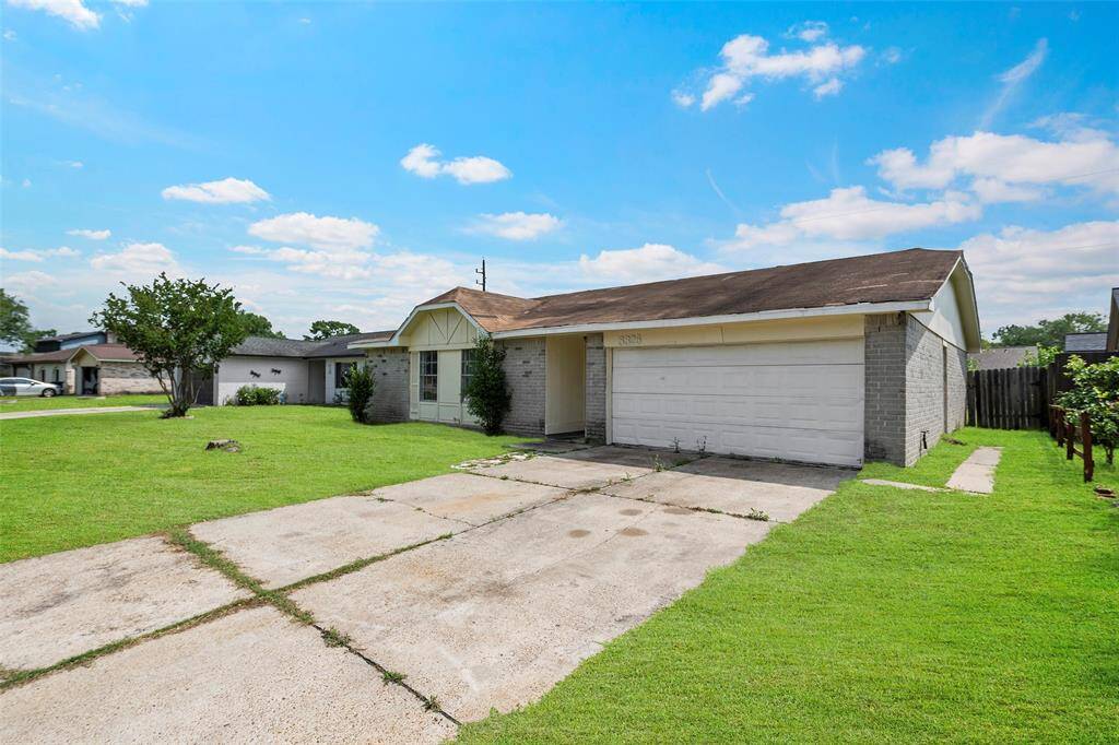 A double wide drive leads to a 2-car garage and provides ample parking for all.
