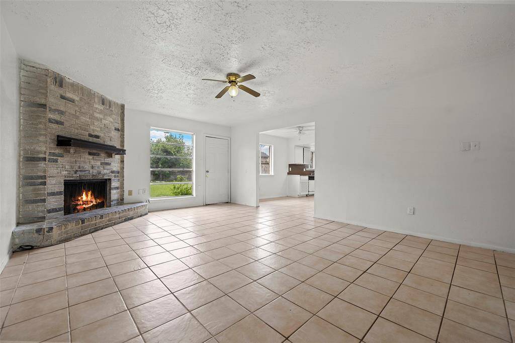A warm and inviting environment can be accredited to the brick fireplace with hearth that will surely warm the hearts of all that gather here!