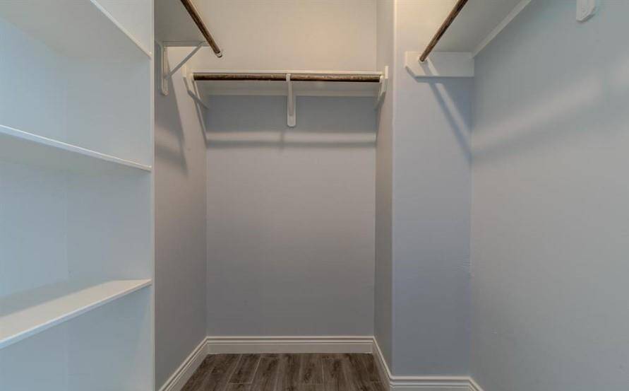 Expansive walk in closet in the Primary Bedroom. This wonderful walk-in closet includes plenty of hanging and shelve space for all your wardrobe needs!