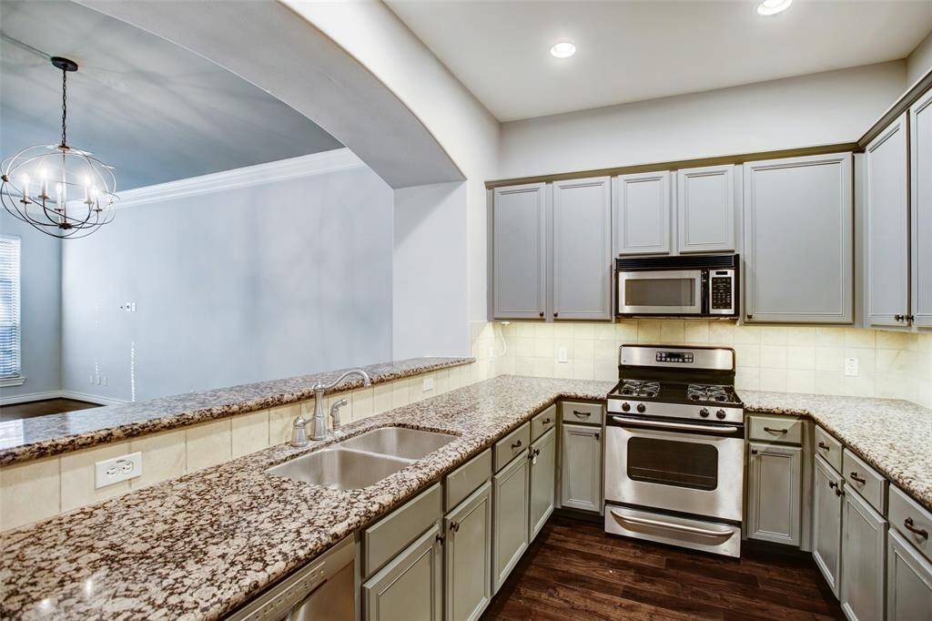 Kitchen opens to the home's dining and living room.