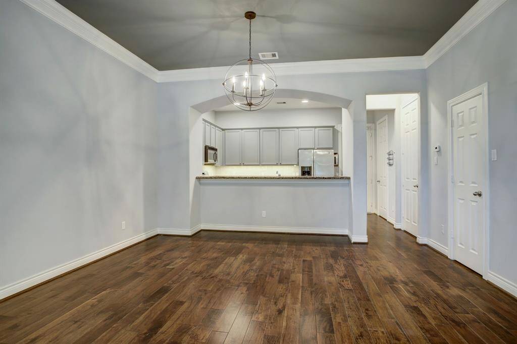 Dining Room View with a designer chandelier.