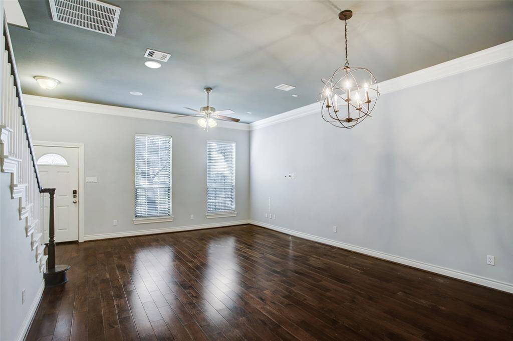 Dining room with a designer chandelier.