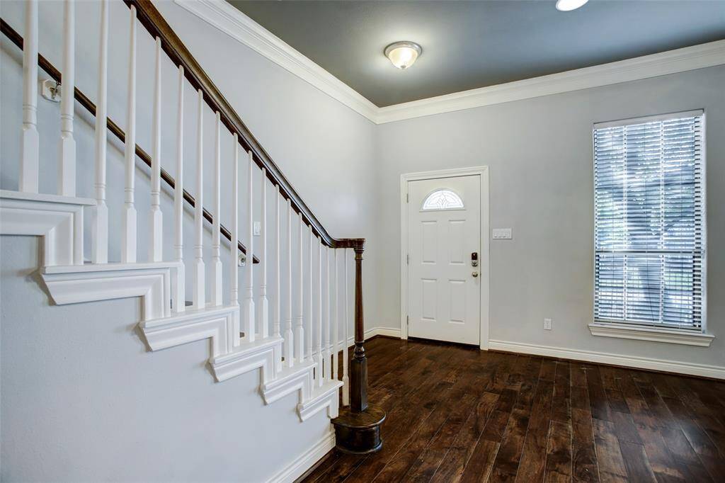 View of the front entry area and the stairs that lead to the homes 2nd floor area.