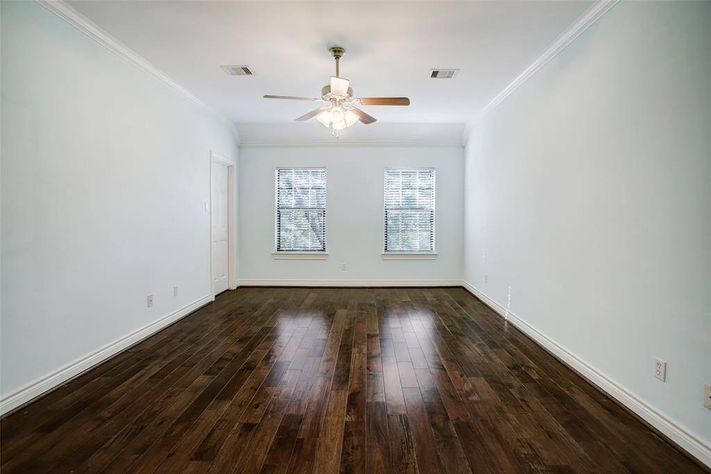 Another view of the primary bedroom.  The door to the left opens into one of the two walk in closets.