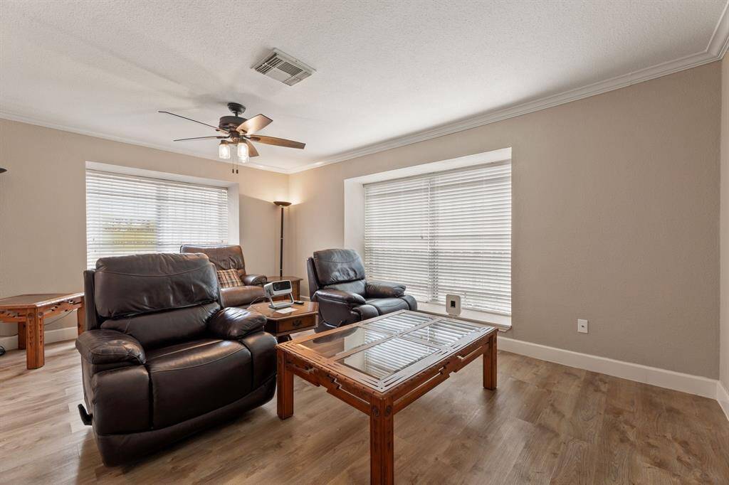 Large living room has two large windows