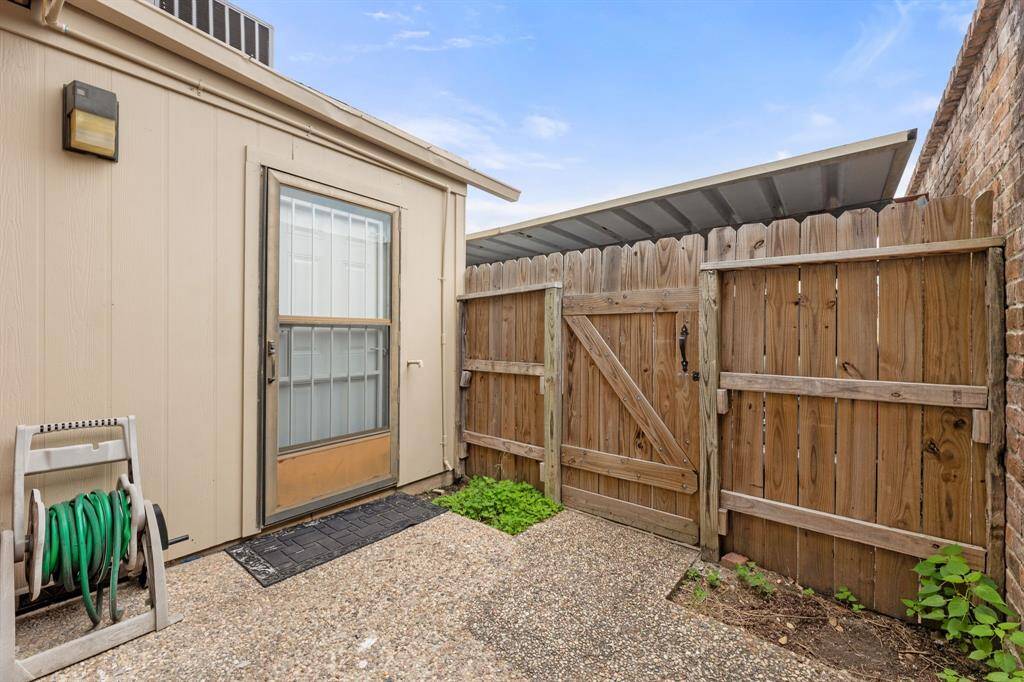 Carport parking on the other side of the fence
