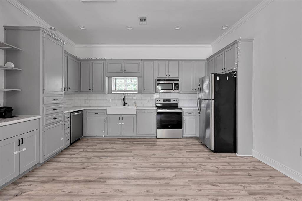 Guest House kitchen includes: Refrigerator, Stove/oven, Farmhouse Sink, Dishwasher.