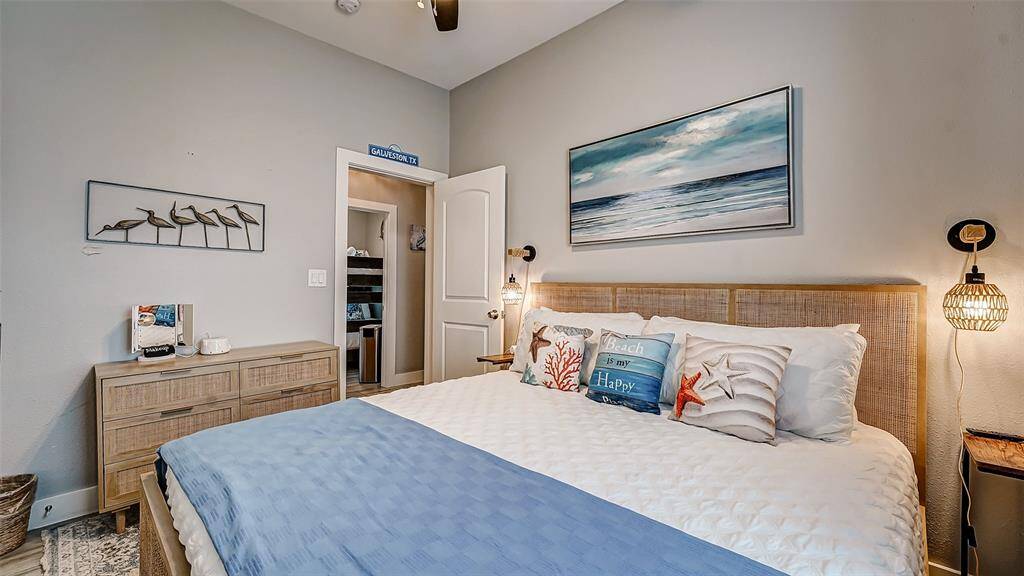 Bedroom 3 has soft blue hues and sconces for reading at night!