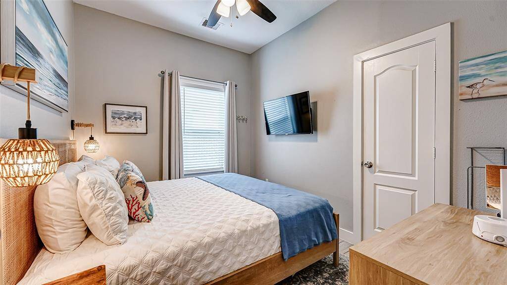 Notice the beachy chic sconces, bedding and accessories.