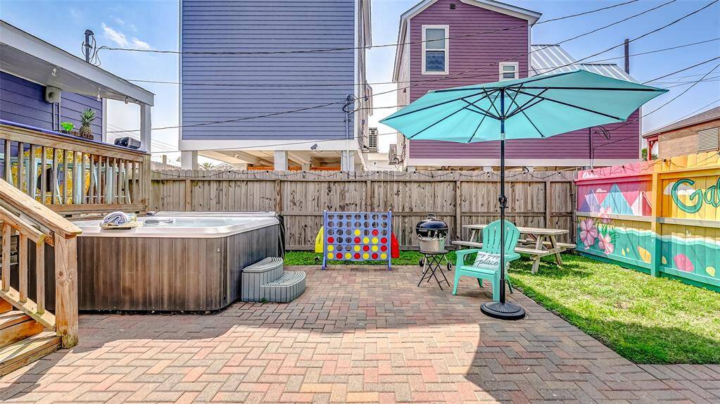 Paver patio with a hot tub AND a heated pool! Room left for kids and pets to run and play!