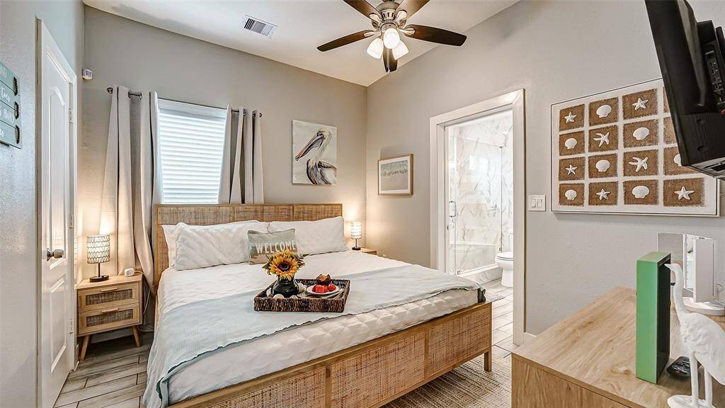Primary bedroom has a high end coastal bed and furnishings and an ensuite bathroom!