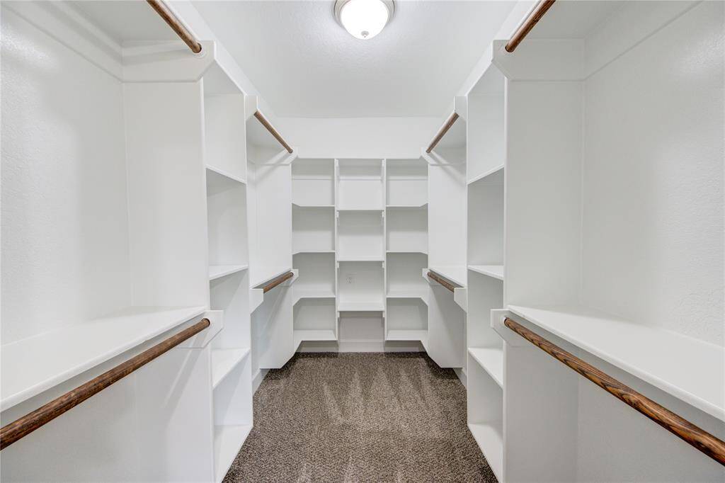 Everyone loves a walk-in custom built closet and this one doesn't disappoint!  Enjoy plenty of space for hanging and folded clothes, shoes, bags and much more!