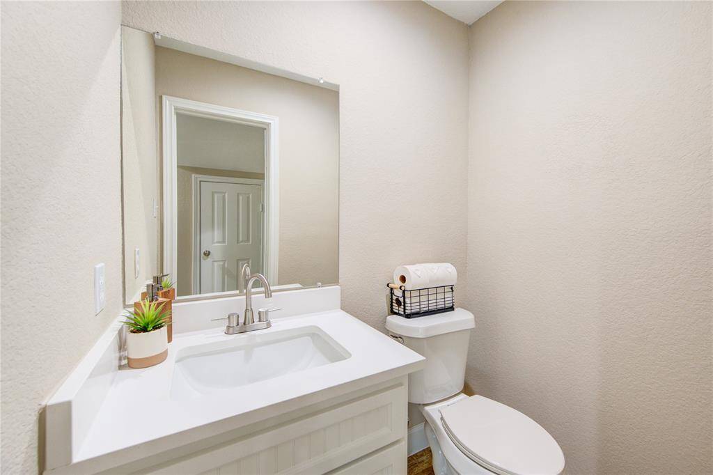 A lovely half bath conveniently located adjacent to the living area.