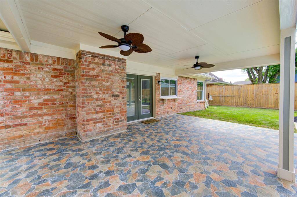 Another view of the stylish and spacious covered patio.