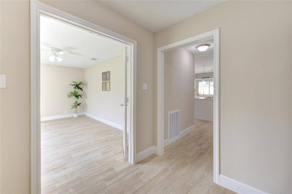 You'll love the neutral-toned colors! Picture shows a glimpse of the flex room/office to the left and the other towards a kitchen area/living area - notice the ample natural light.