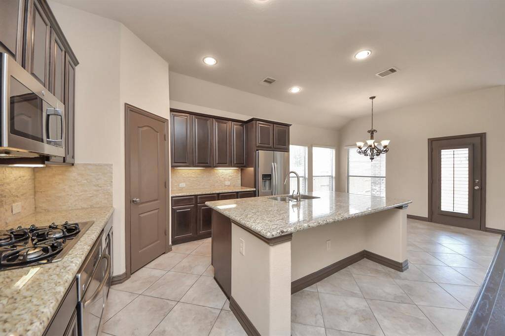 Plenty of cabinets, beautiful finishes, and room for all your culinary adventures.