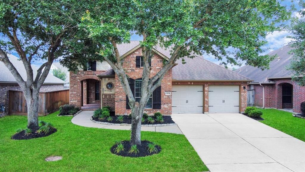 Curb appeal goals! This brick beauty boasts mature trees and a welcoming entryway that sets the tone for what’s inside.