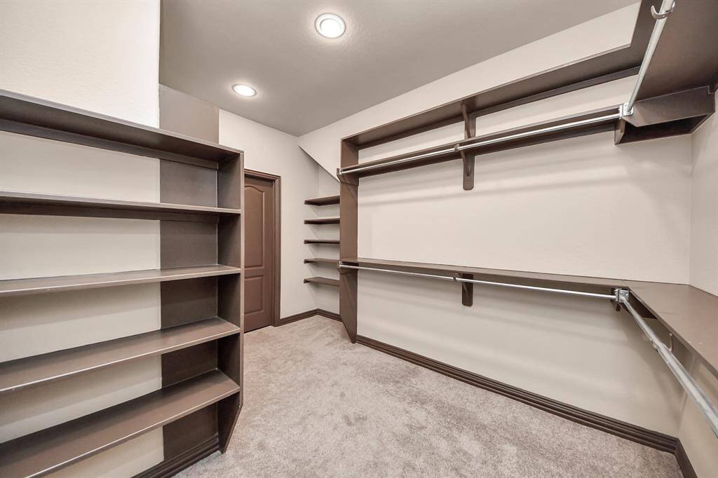 Spacious and bright with plush carpet and a large window—ideal for guests or family!