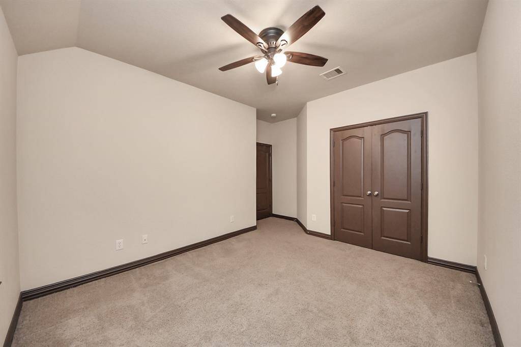 This expansive upstairs game room offers plenty of space for your media setup, game tables, or a cozy second living area!