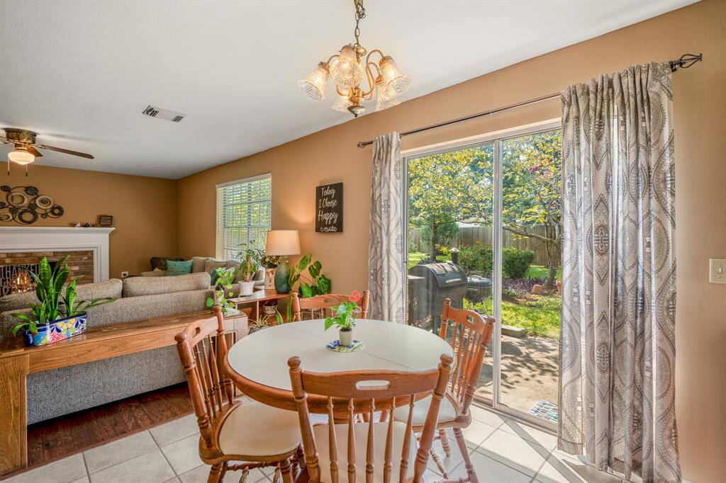 The breakfast area overlooks the family room and offers a large sliding glass door with a great view of the backyard