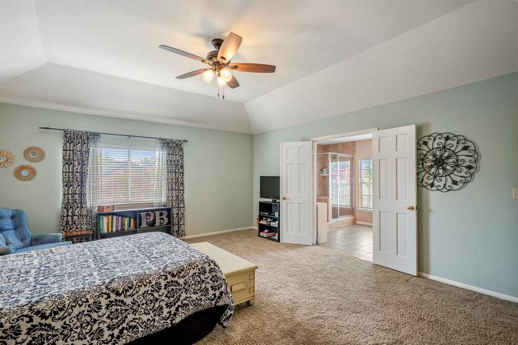 The double doors lead to the primary en-suite